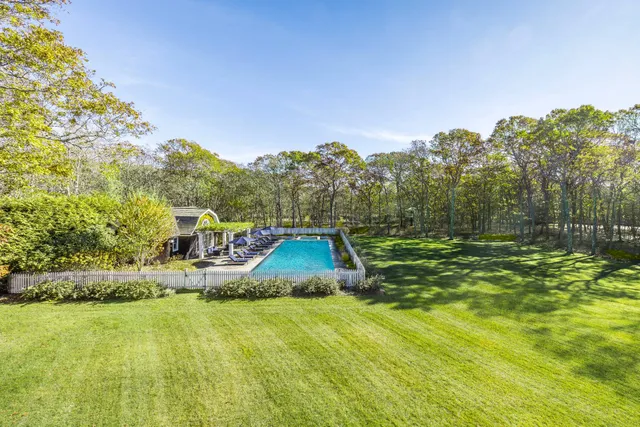 a view of a swimming pool with an outdoor space and seating area
