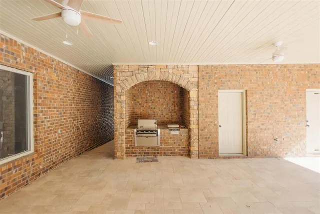 an empty room with furniture and natural light