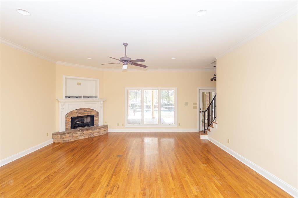 11111 Latting Road Eads, TN 38028 - Photo 5 of 40 a view of empty room with fireplace and wooden floor