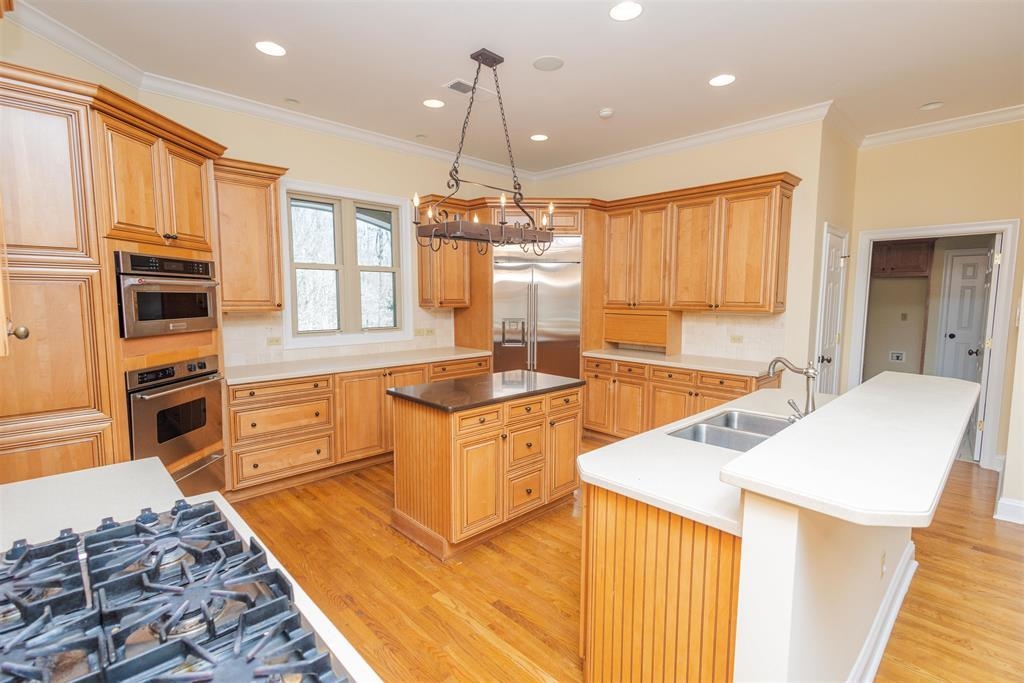 11111 Latting Road Eads, TN 38028 - Photo 7 of 40 a kitchen with stainless steel appliances granite countertop a sink stove and refrigerator