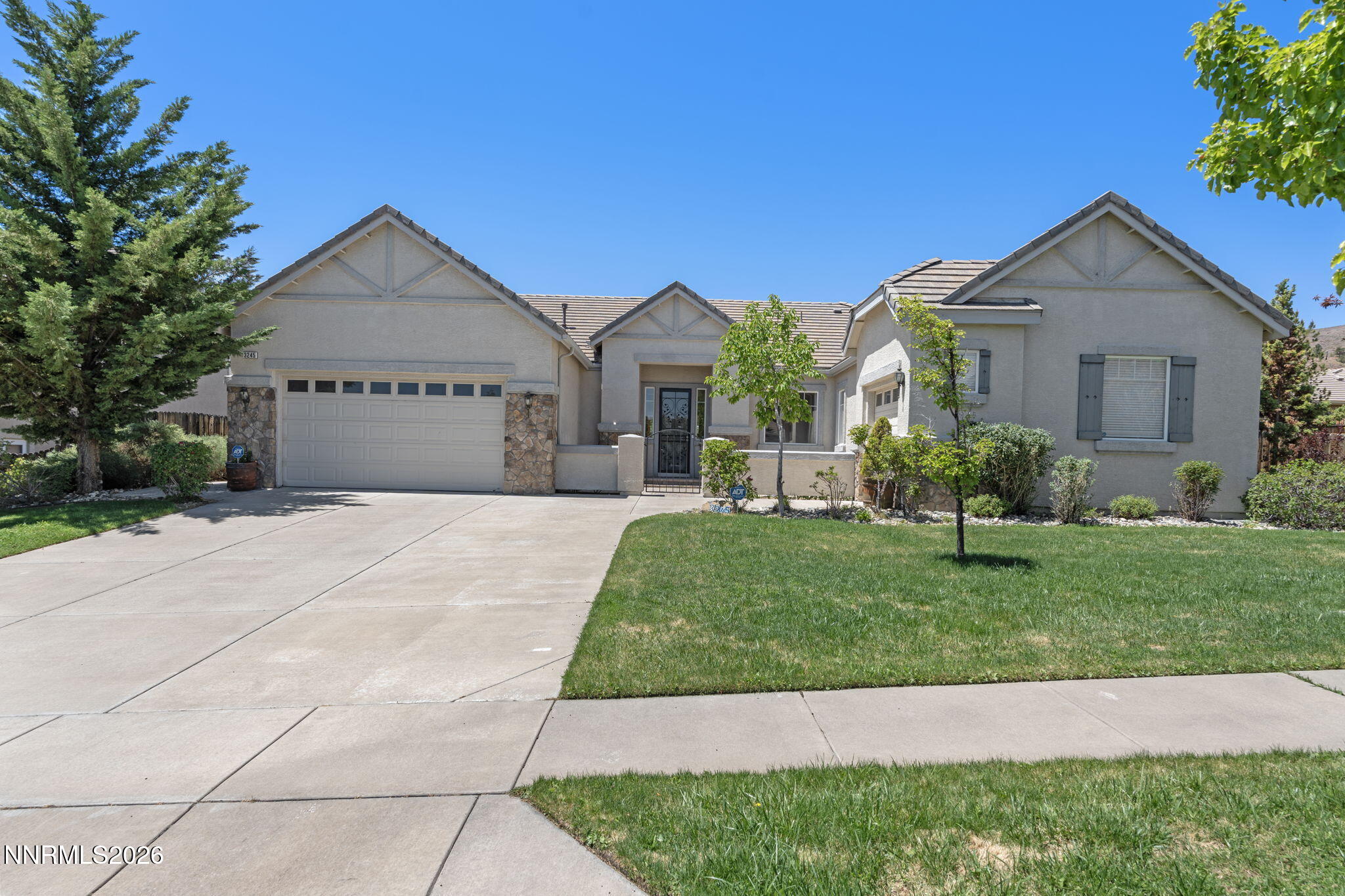 3245 Quartzite Drive Reno, NV 89523 - Photo 2 of 56 a front view of a house with a yard