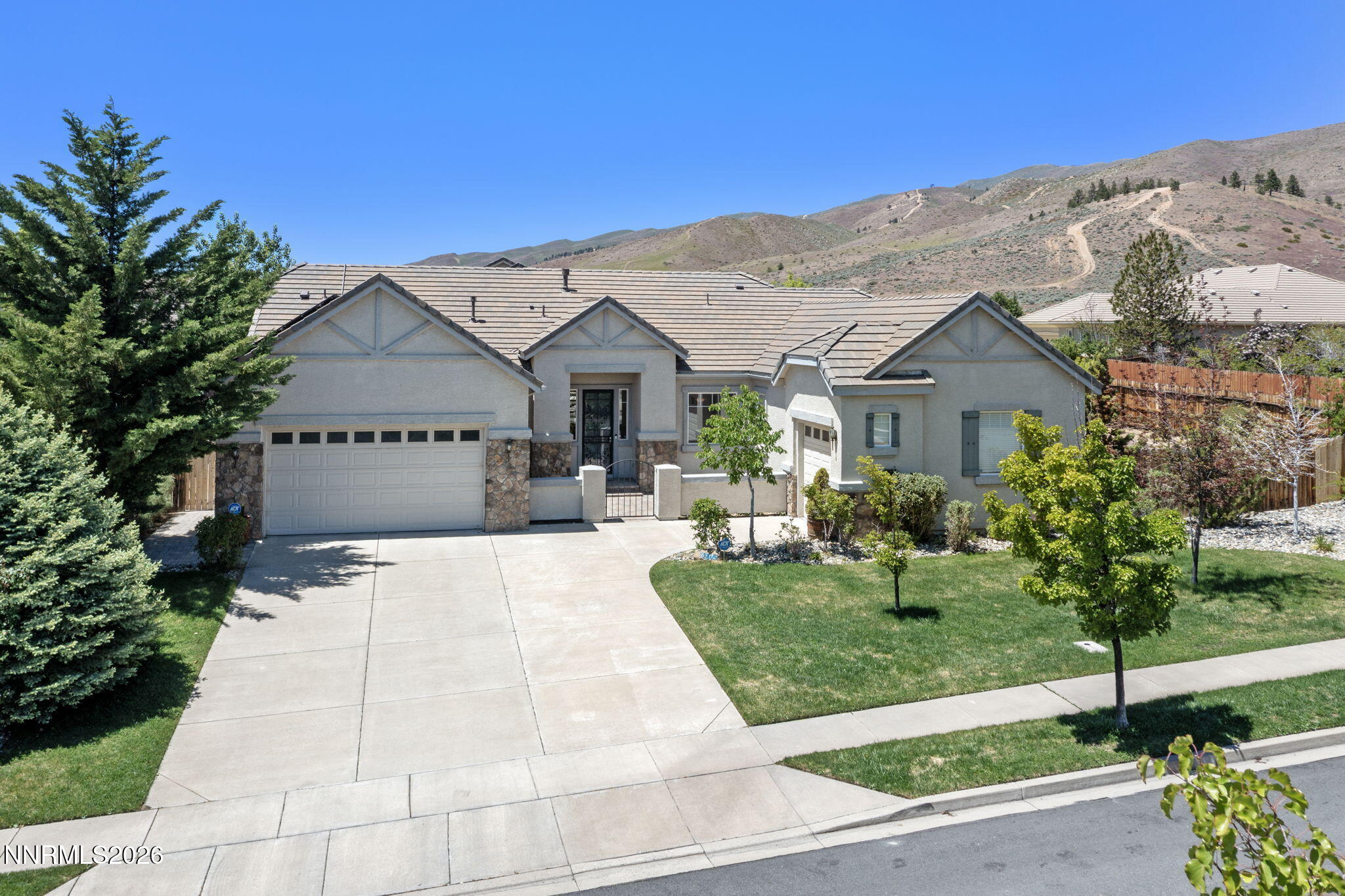 3245 Quartzite Drive Reno, NV 89523 - Photo 6 of 56 a front view of a house with garden