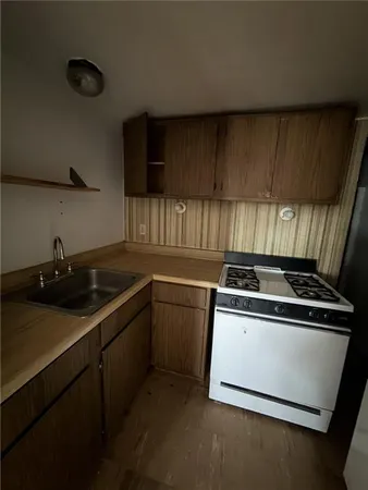 a kitchen with a stove and a sink