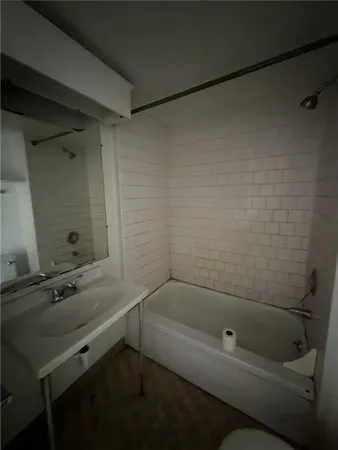 a bathroom with a sink and a bathtub