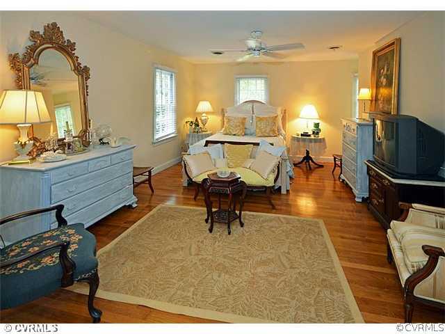 2151 Castlebridge Road Midlothian, VA 23113 - Photo 10 of 24 a living room with fireplace furniture and a flat screen tv