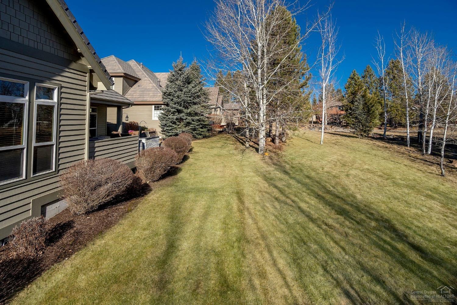 61842 Fall Creek Loop Bend, OR 97702 - Photo 20 of 22 Backyard is adjacent to common area and