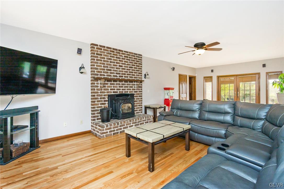675 Bower Road Nazareth, PA 18064 - Photo 18 of 49 a living room with furniture a flat screen tv and a fireplace
