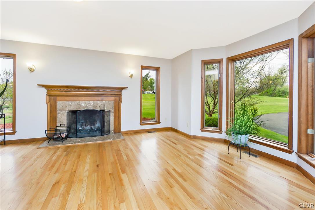 675 Bower Road Nazareth, PA 18064 - Photo 8 of 49 a view of empty room with wooden floor and fireplace