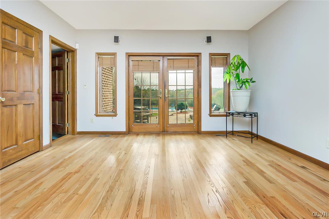 675 Bower Road Nazareth, PA 18064 - Photo 10 of 49 wooden floor in an empty room with a window
