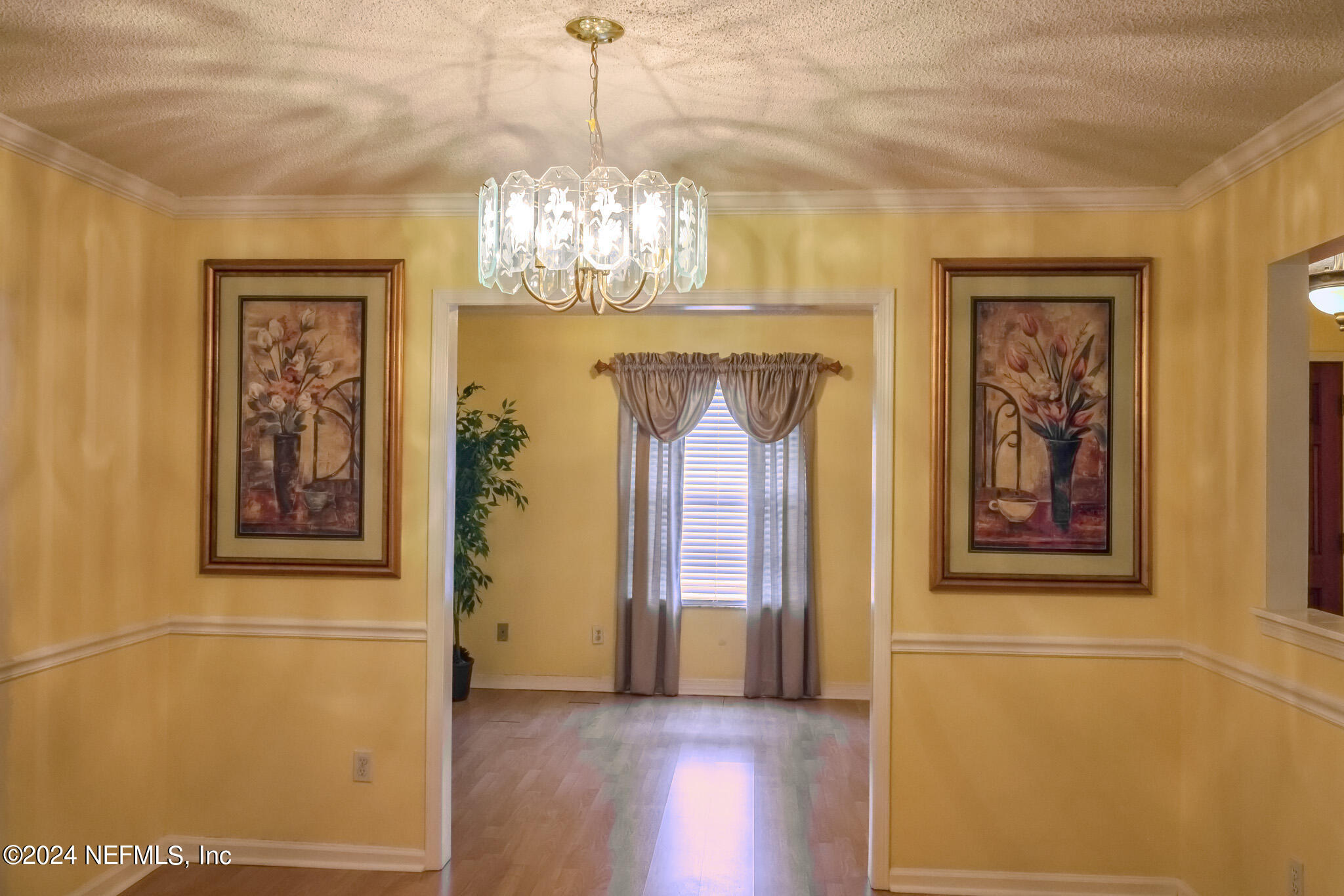 1662 Rusty Rail Road Jacksonville, FL 32225 - Photo 12 of 27 a view of a chandelier in a room