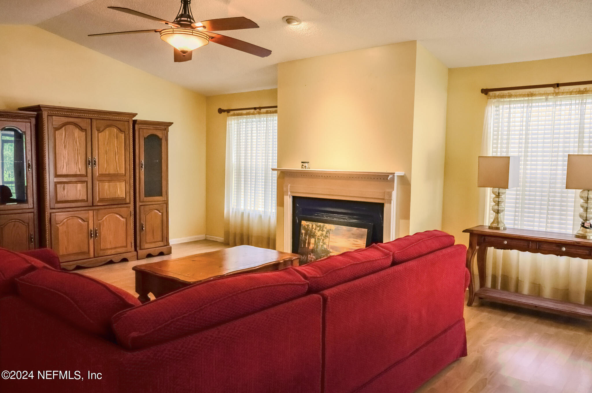 1662 Rusty Rail Road Jacksonville, FL 32225 - Photo 13 of 27 a living room with furniture ceiling fan and a window
