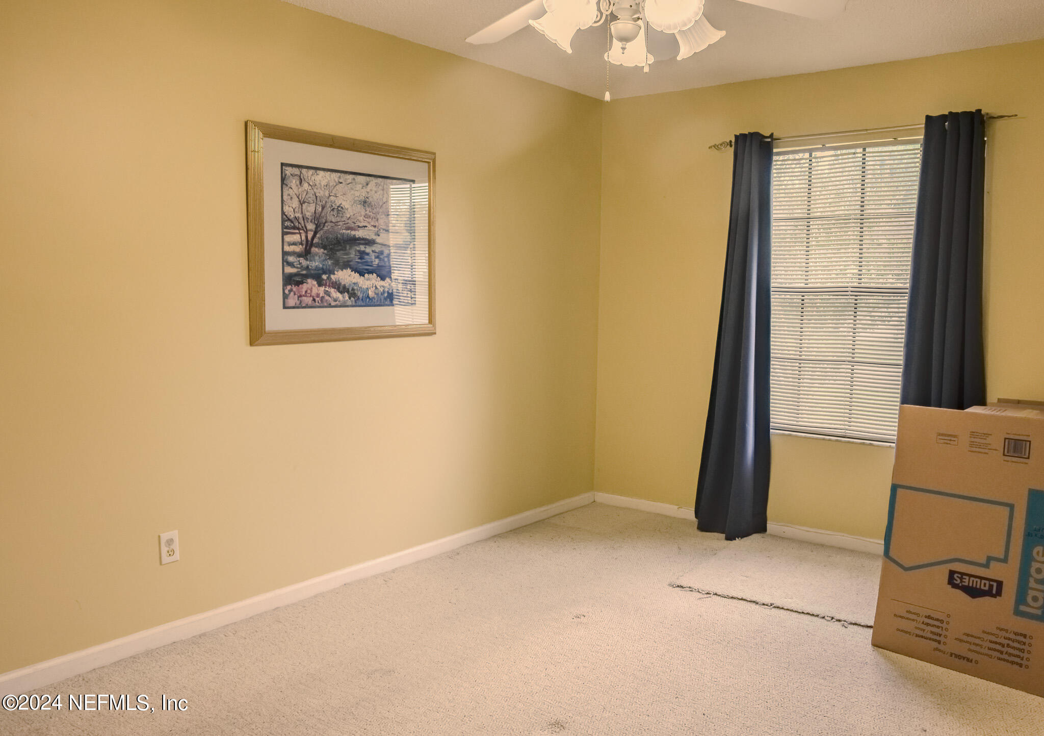 1662 Rusty Rail Road Jacksonville, FL 32225 - Photo 20 of 27 a view of an empty room with a window