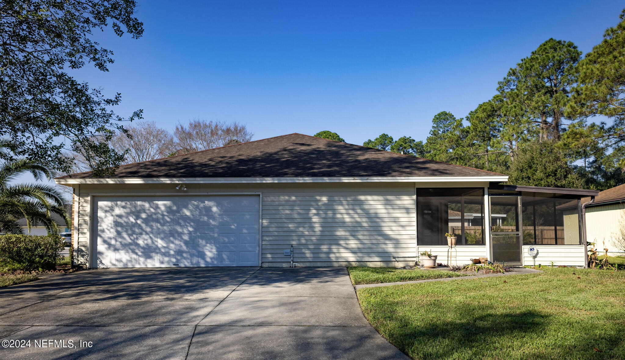 1662 Rusty Rail Road Jacksonville, FL 32225 - Photo 2 of 27 a front view of a house with a garden and yard