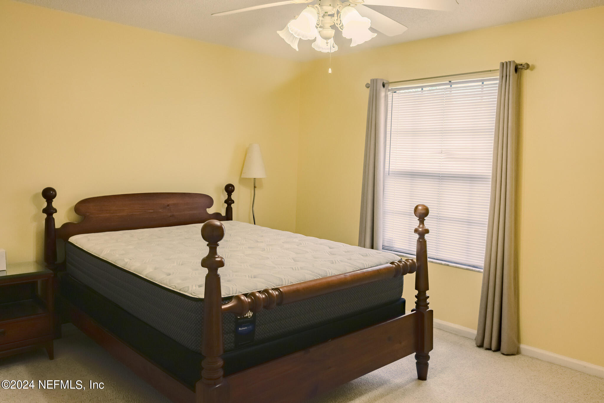 1662 Rusty Rail Road Jacksonville, FL 32225 - Photo 21 of 27 a bed sitting in a bedroom next to a window