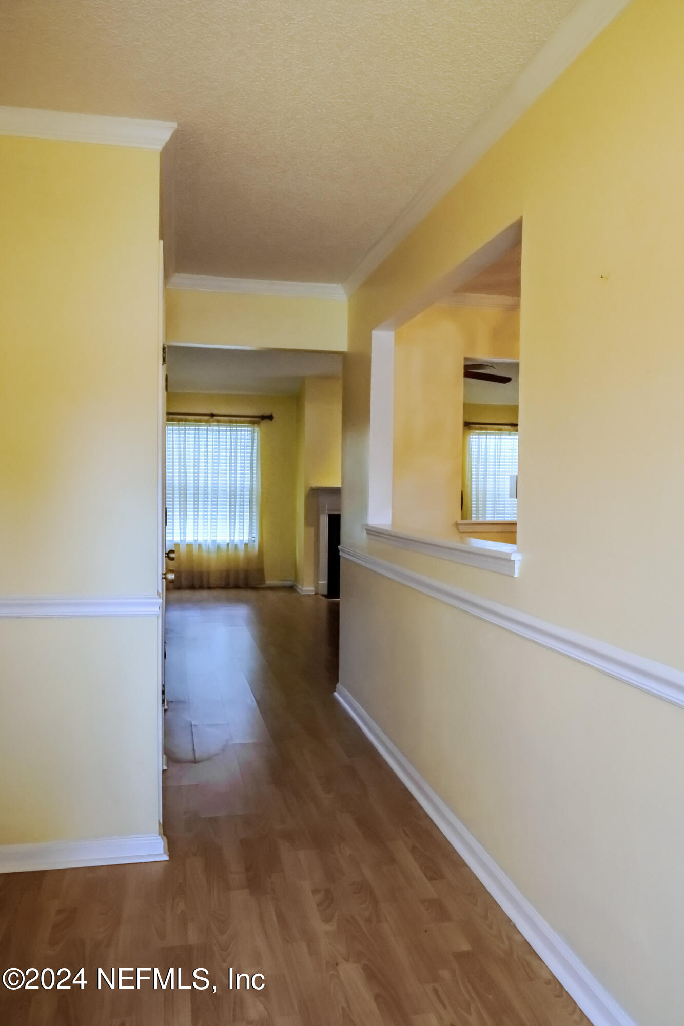 1662 Rusty Rail Road Jacksonville, FL 32225 - Photo 7 of 27 a view of empty room with wooden floor and fan