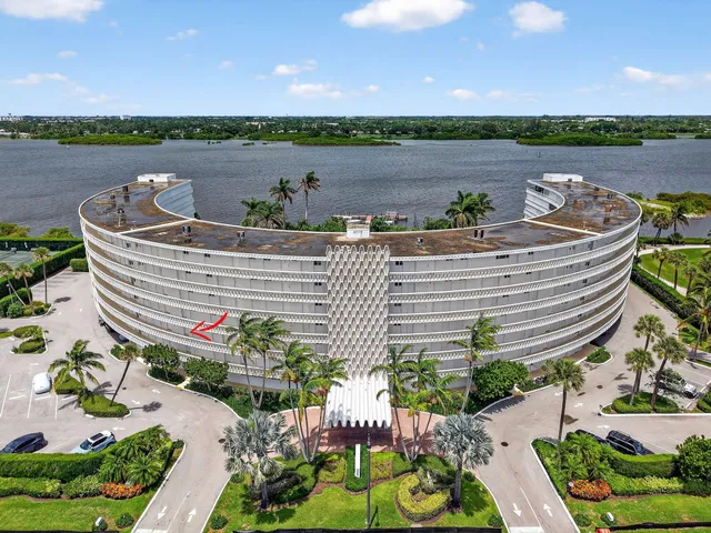 a view of a lake with a table and a chairs
