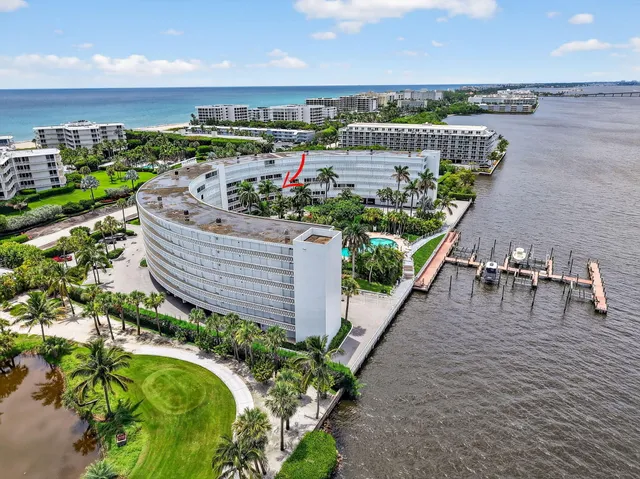 a view of a balcony with wooden floor and outdoor seating