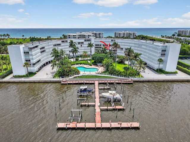 an aerial view of a house with a lake view