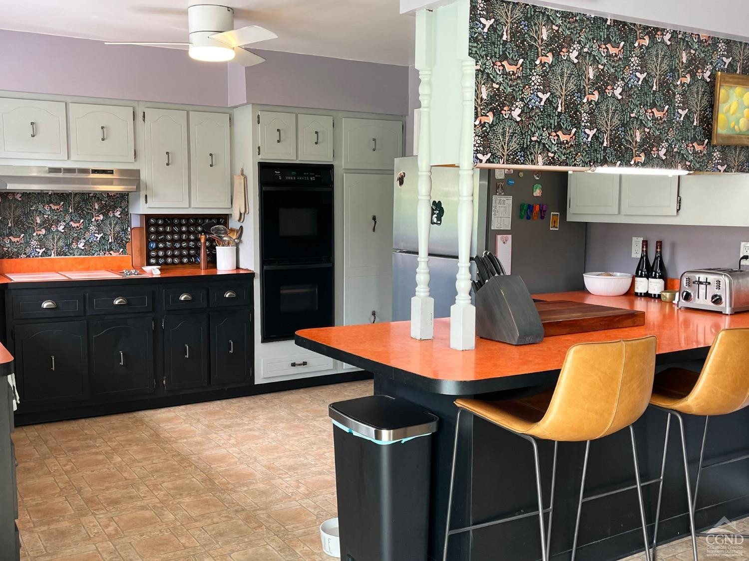60 Burma Road Kinderhook, NY 12106 - Photo 13 of 43 a kitchen with a kitchen island a stove a table and chairs