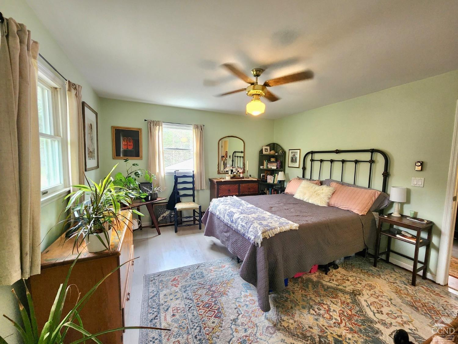 60 Burma Road Kinderhook, NY 12106 - Photo 16 of 43 a bedroom with a bed a dresser and potted plant