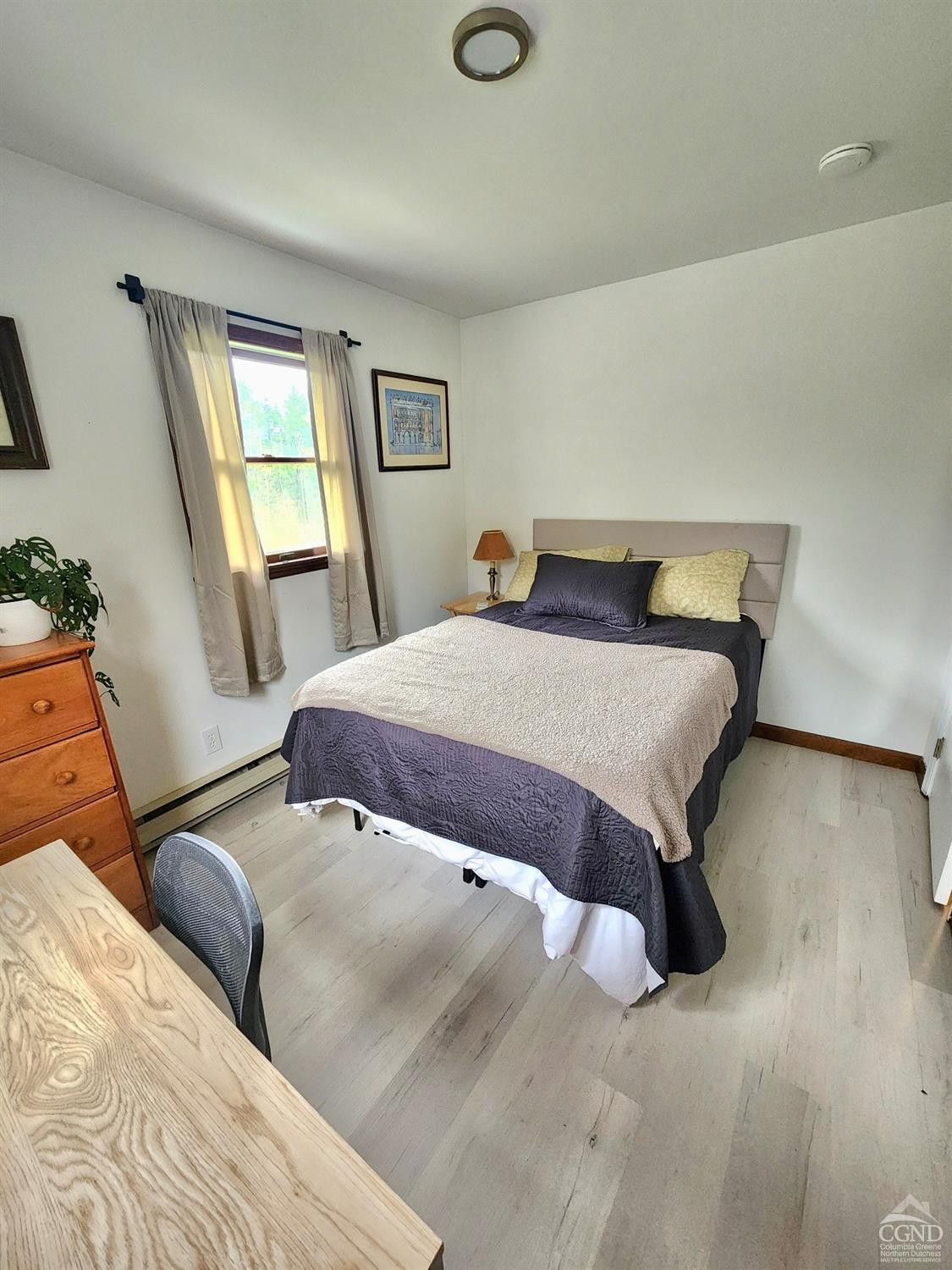 60 Burma Road Kinderhook, NY 12106 - Photo 18 of 43 a bedroom with a bed and wooden floor