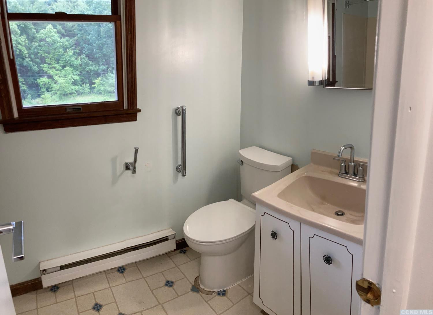 60 Burma Road Kinderhook, NY 12106 - Photo 24 of 43 a white toilet sitting next to a bathroom sink