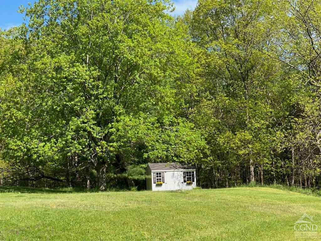 60 Burma Road Kinderhook, NY 12106 - Photo 34 of 43 a house view with a sitting space and garden