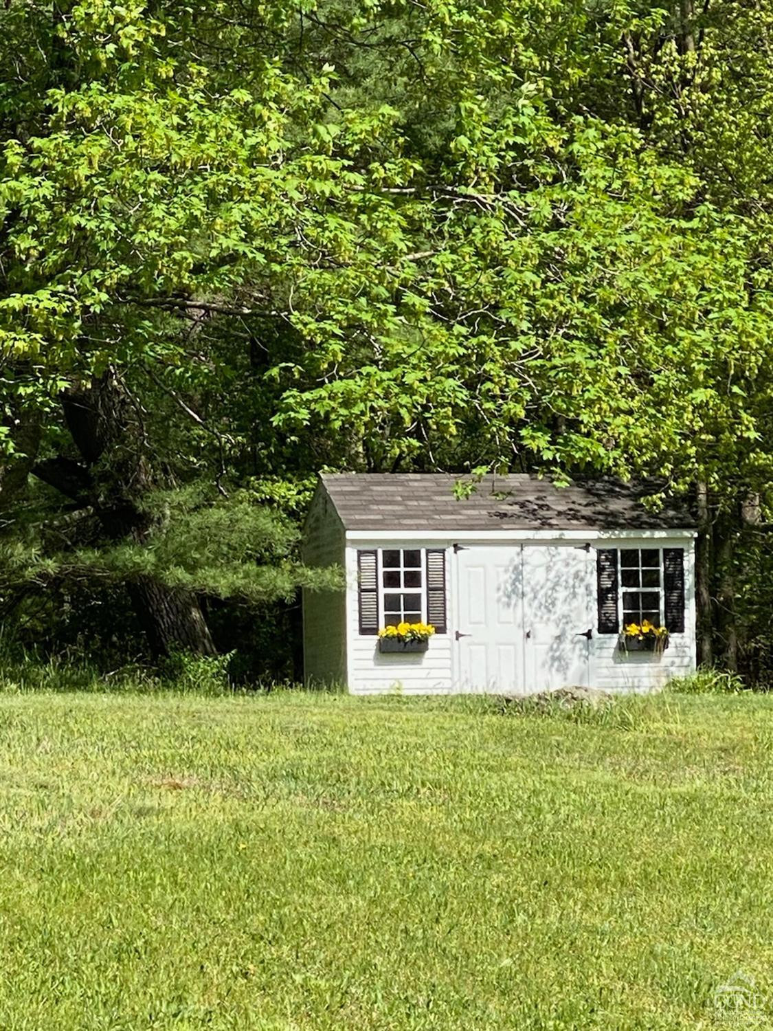 60 Burma Road Kinderhook, NY 12106 - Photo 36 of 43 a house view with a garden space