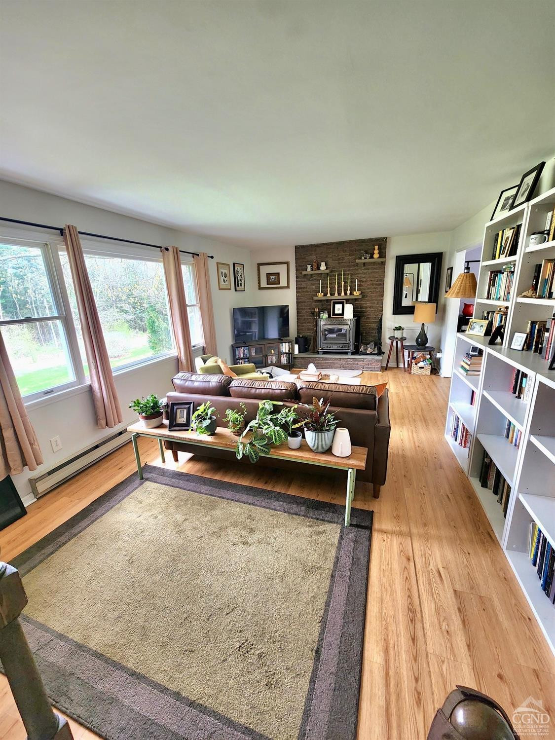 60 Burma Road Kinderhook, NY 12106 - Photo 6 of 43 a living room with furniture hard wood floor and a large window