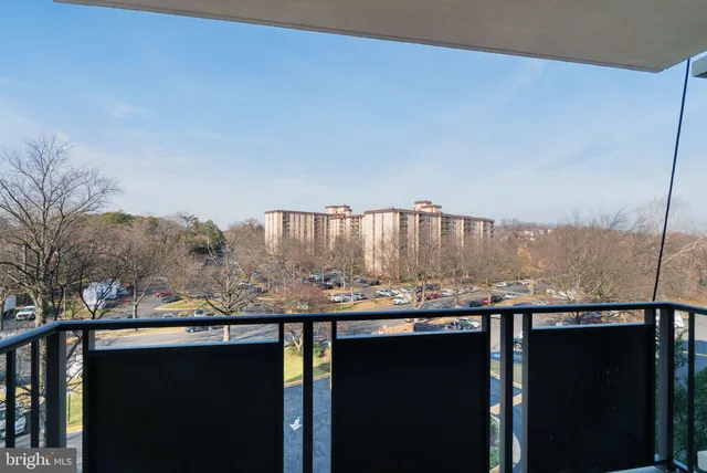 a view of deck with mountain and ocean view