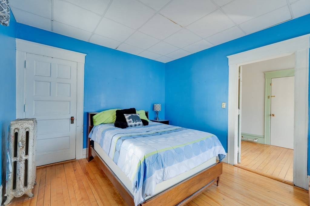 23 Germain Street Worcester, MA 01602 - Photo 22 of 42 a bedroom with a bed and a table