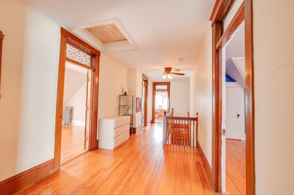 23 Germain Street Worcester, MA 01602 - Photo 29 of 42 a view of empty room with wooden floor and fan