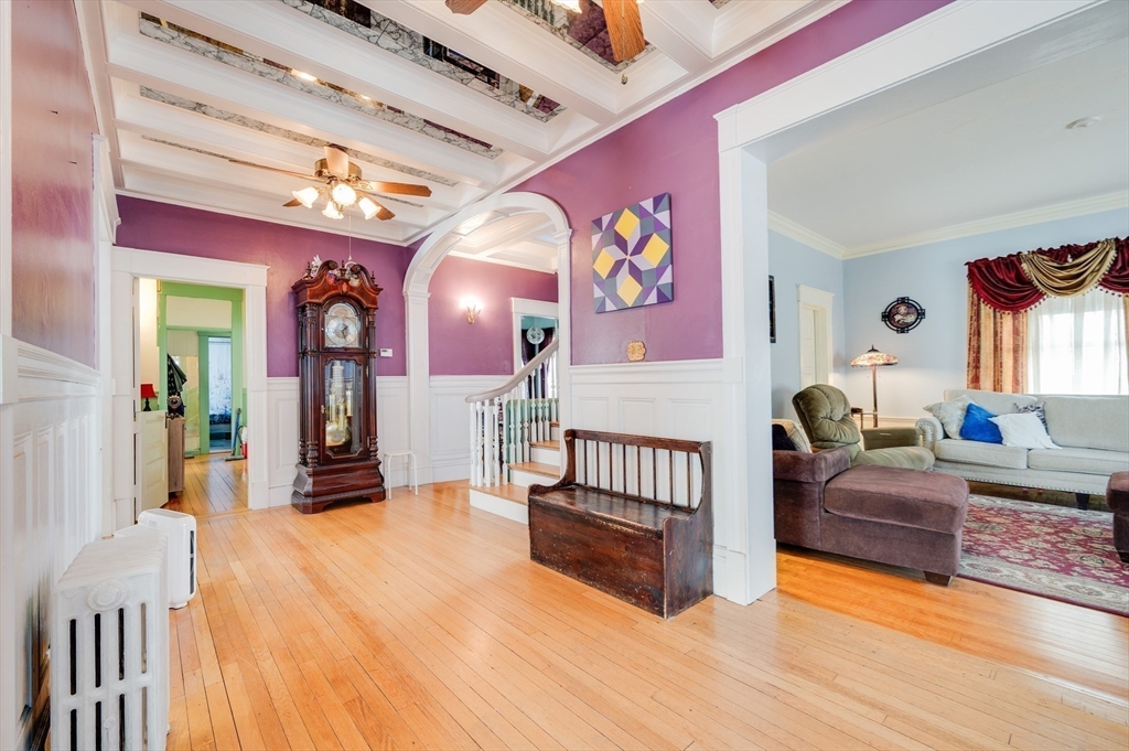 23 Germain Street Worcester, MA 01602 - Photo 3 of 42 a bedroom with furniture and a wooden floor