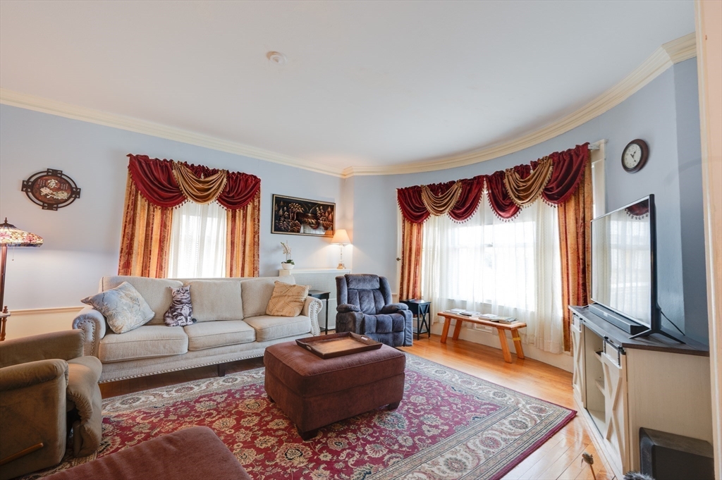 23 Germain Street Worcester, MA 01602 - Photo 4 of 42 a living room with furniture and a flat screen tv
