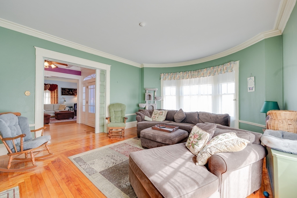 23 Germain Street Worcester, MA 01602 - Photo 7 of 42 a living room with furniture and a wooden floor