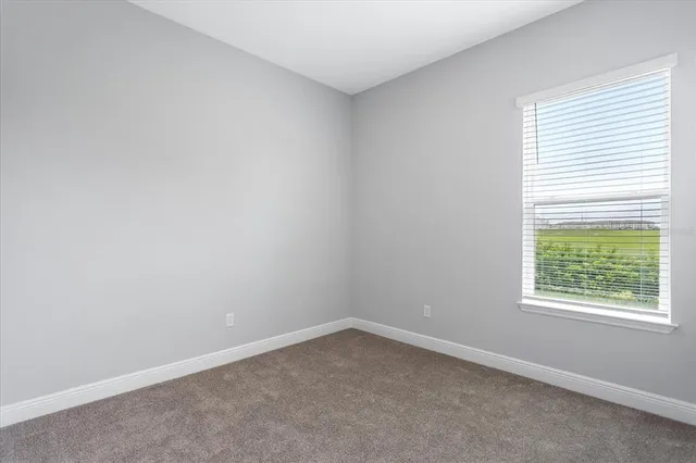 an empty room with closet area