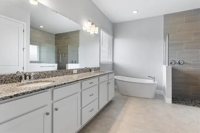a white bath tub sitting in a bathroom