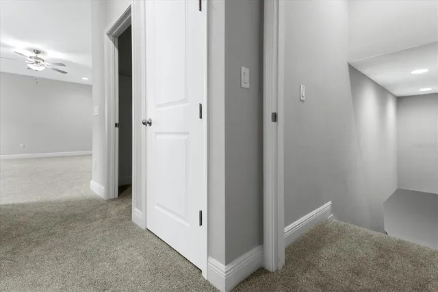 a view of an empty room with windows