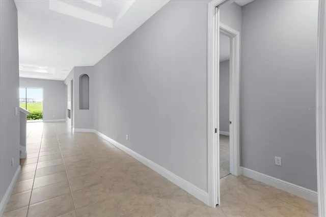 a view of hallway with wooden floor