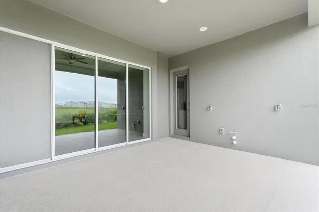 an aerial view of a house with a garden and lake view