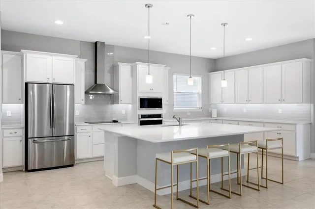 a view of a livingroom with furniture and a chandelier
