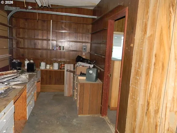a view of an empty room with a empty space and a window