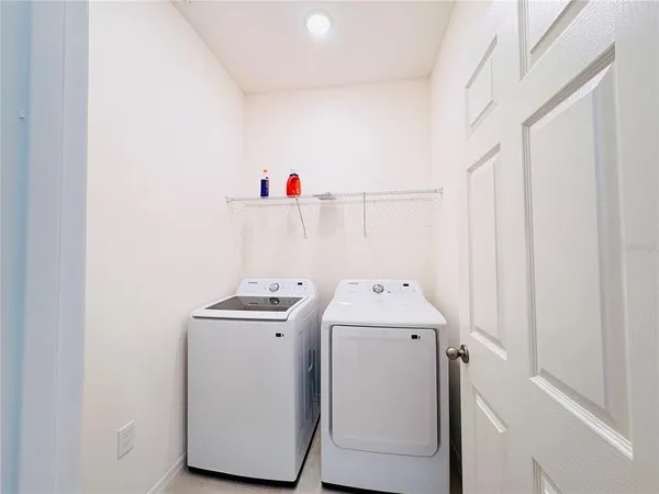 a utility room with dryer and washer