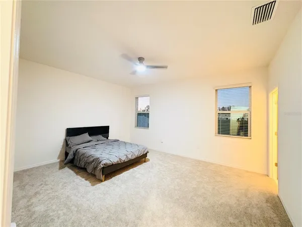 a bedroom with a bed and a cabinets