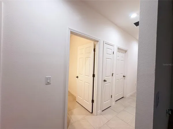 a view of a hallway with two doors