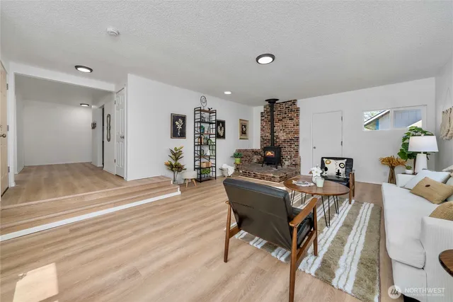 a view of a livingroom with furniture and wooden floor