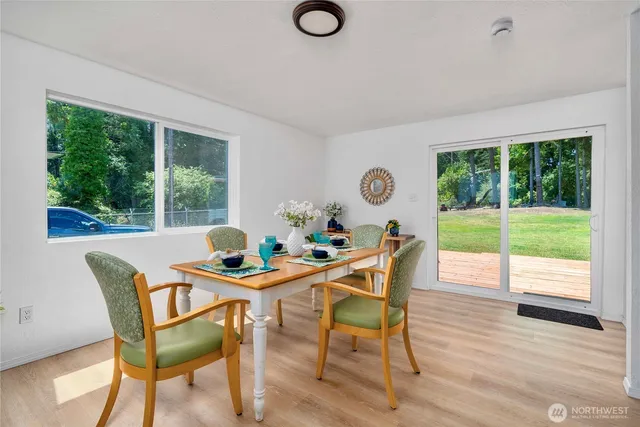 a dining room with furniture and window