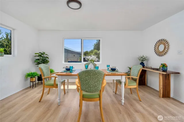 a view of a dining room with furniture and wooden floor