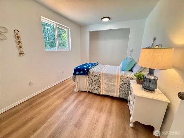 a bedroom with bed and window