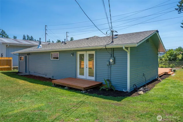 a view of a backyard with plants and a table